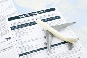 plane model on travel insurance document